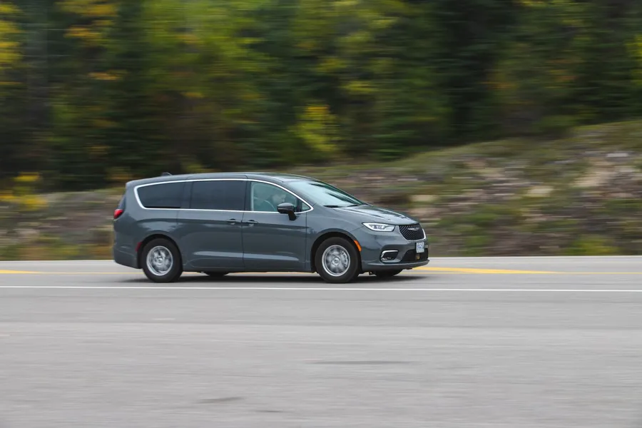 A large minivan driving on the expressway